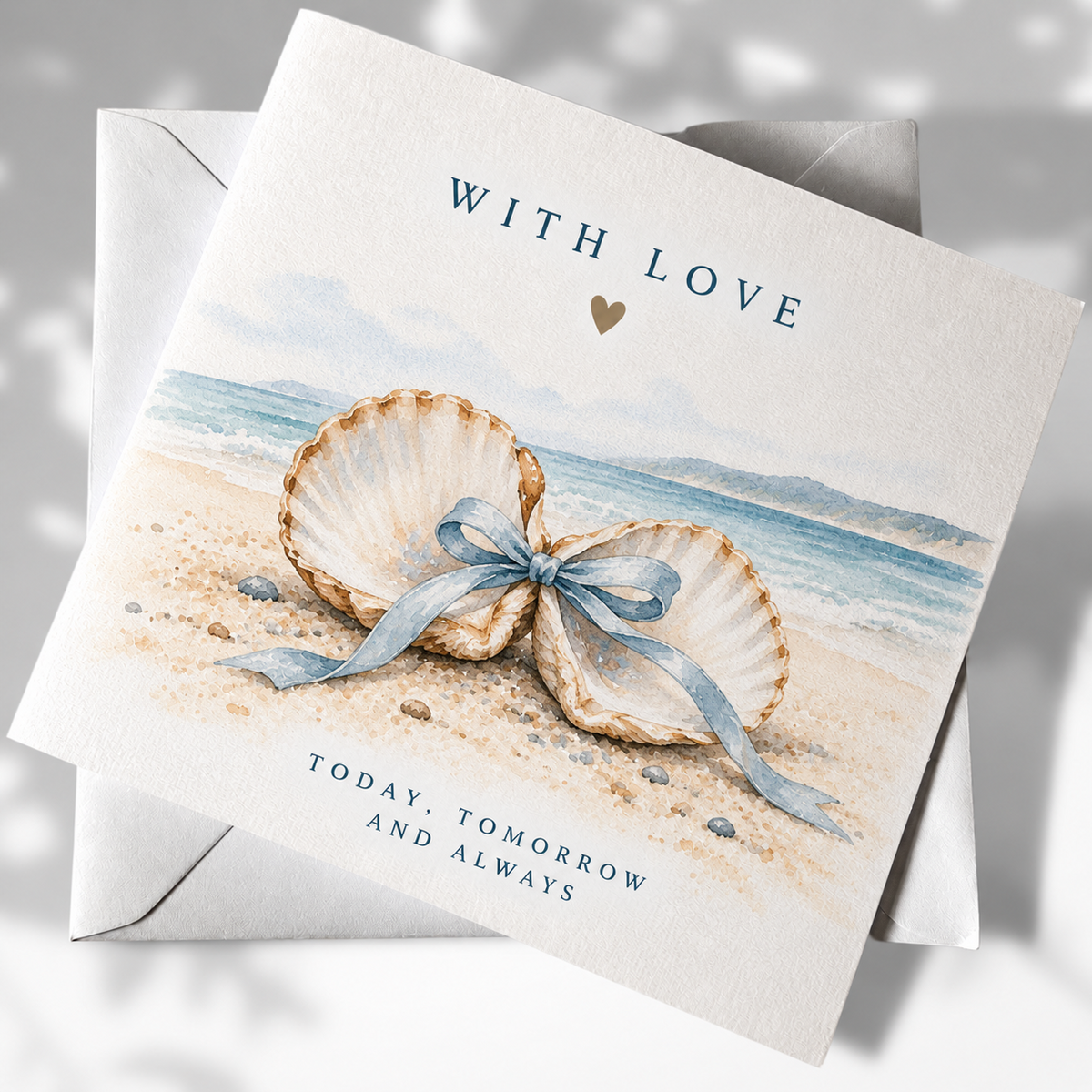 With Love coastal greeting card with tied shells on a beach